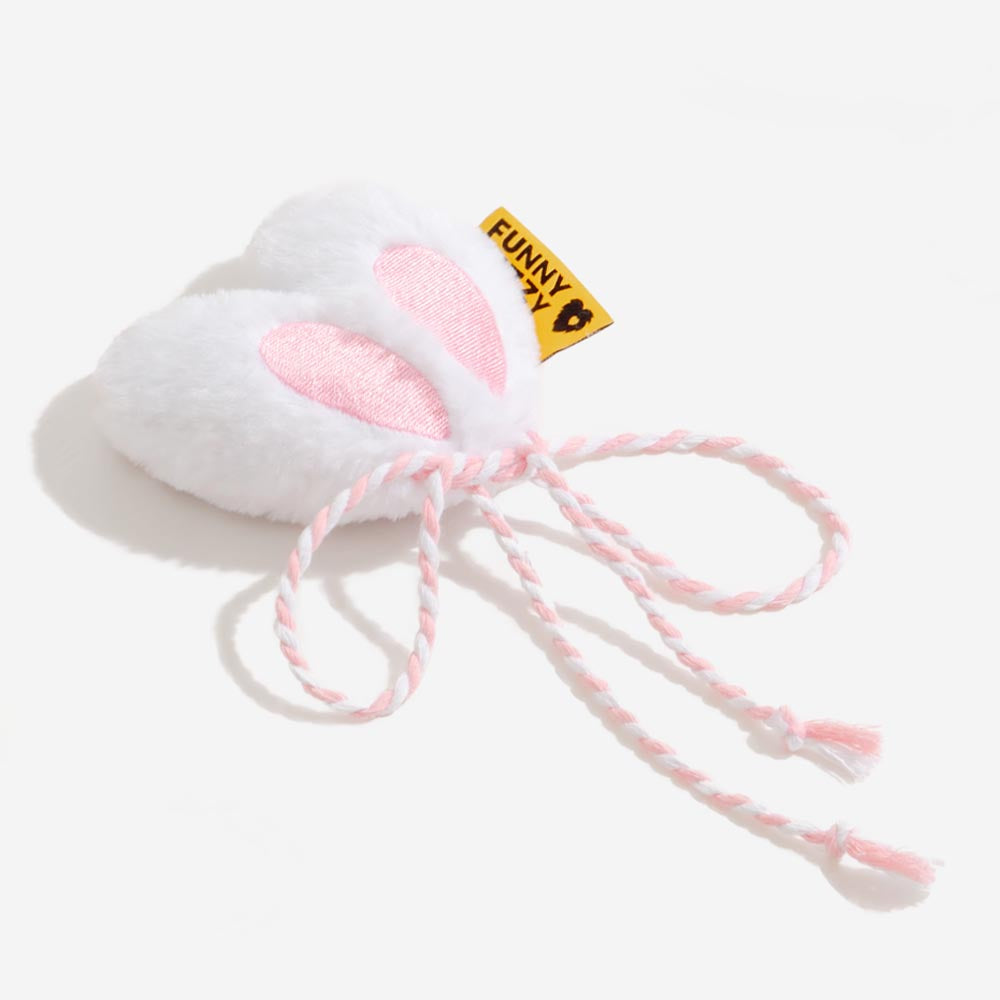 Floppy looped ears with tie-cord—tug, toss, repeat.
